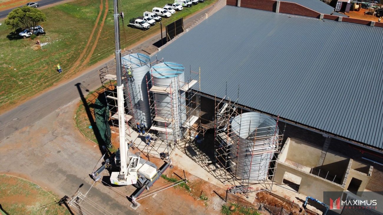 Crane-assisted tank assembly